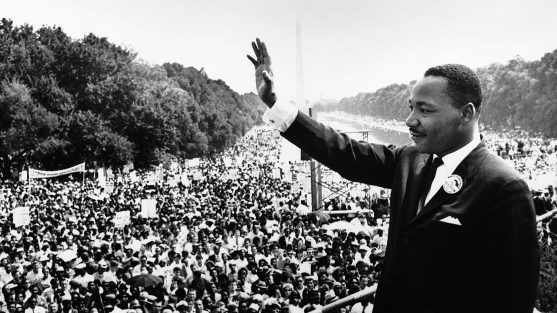 Black and white photo of Martin Luther King Jr. speaking to a crowd in Washington DC. 